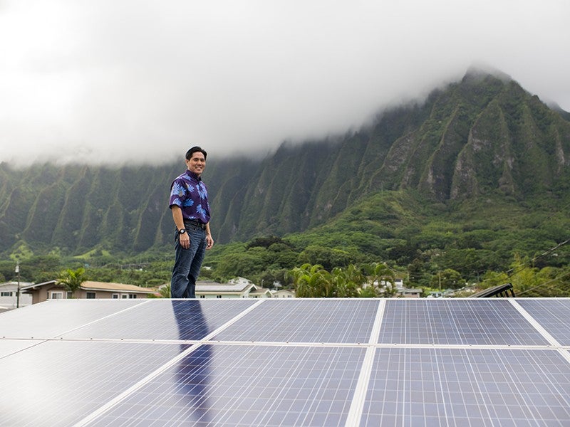 Earthjustice Managing Attorney Isaac Moriwake surveys rooftop solar
