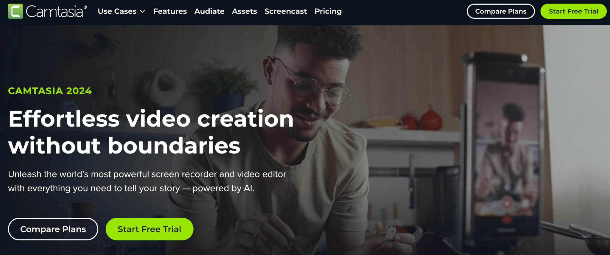 Camtasia landing page showing a man with glasses filming themselves while demonstrating a creative task