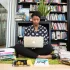 black-woman-sitting-on-the-floor-with-a-laptop