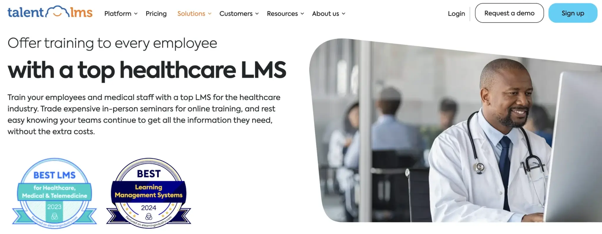 TalentLMS landing page promoting healthcare LMS for employee and medical staff training, featuring a doctor using a computer and award badges for Best LMS for Healthcare and Learning Management Systems.